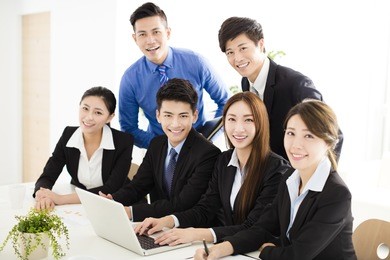 happy young business people working in office