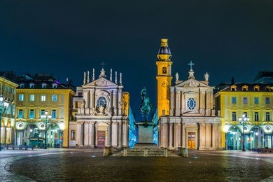 night view of the illuminated piazza san carlo with church saint carlo borromeo - church of saint cristina and carlo in the italian city torino.