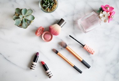 perfume make up marble flat lay