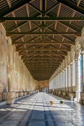 view of a corridor of the camposanto cemetery in pisa, italy