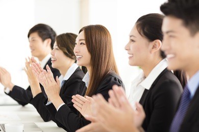 happy business people applauding in  conference