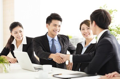 business people shaking hands during meeting