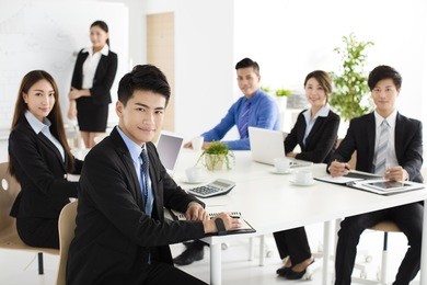 group of happy young business people in  meeting