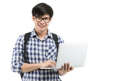 handsome young asian man using laptop computer on isolated background