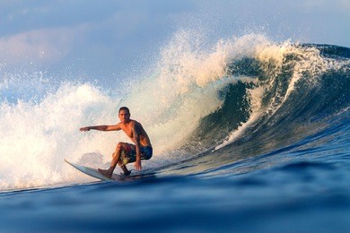 picture of surfing a wave.sumbawa island. indonesia.