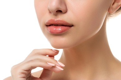 close up view of young beautiful caucasian woman face isolated over white background. lips contouring, spa therapy, skincare, cosmetology and plastic surgery concept