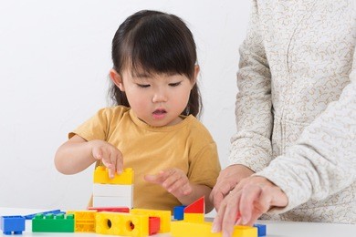 cute asian girl playing blocks
