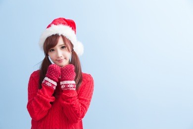 happy christmas beauty woman wears red shirt isolated on blue background, asian