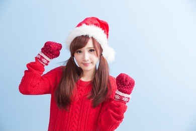 happy christmas beauty woman wears red shirt isolated on blue background, asian