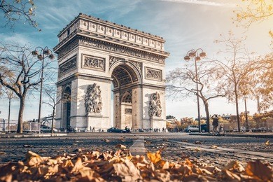 arc de triomphe located in paris, in autumn scenery.