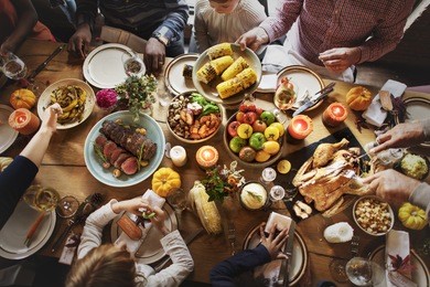 people celebrating thanksgiving holiday tradition concept