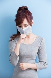woman have a sick and painful isolated on blue background, asian