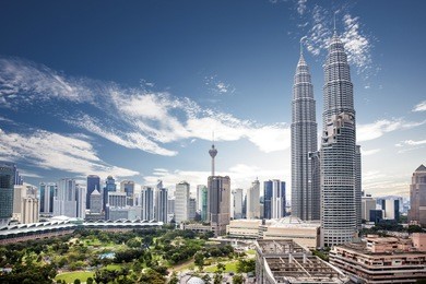 landscape of  kuala lumpur skyline, malaysia under cloudy blue sky