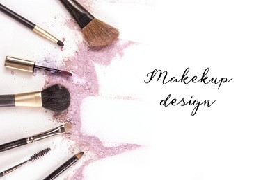 makeup brushes, lip gloss and pencil on white background, with traces of powder and blush forming a frame. a horizontal template for a makeup artist's business card or flyer design, with copyspace