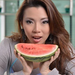 housewife eating watermelon fruit for diet 