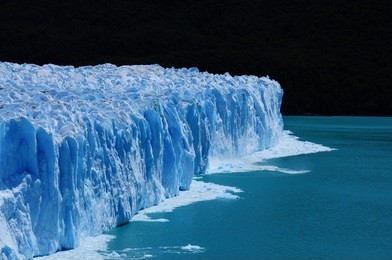 ice calving at perito moreno glacier, the most famous tourist attractions in patagonia, argentina. beautiful landscape of patagonia. climate change, global warming, melting glacier.
