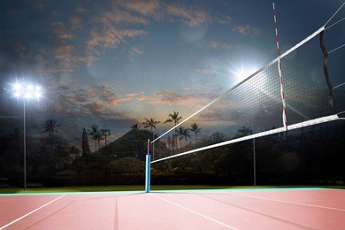 night empty professional volleyball open air court with net