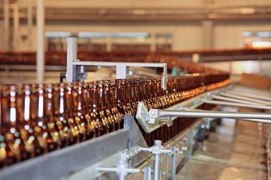 conveyer line with many beer bottles