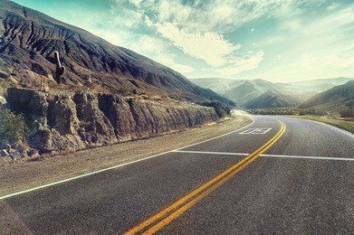 cinematic road landscape. humahuaca valley, altiplano, argentina. misty road. mist. cross-processed. vintage style. instagram filter.