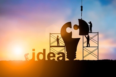 silhouette team business engineer work connecting jigsaw puzzle piece together team responsible for the idea of progress and teamwork potential and motivate employee growth over blurred natural.