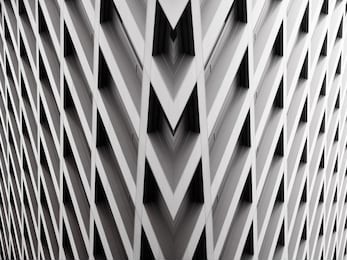 modern office building with angular / rhombus structure of cells. reworked abstract architecture photo.