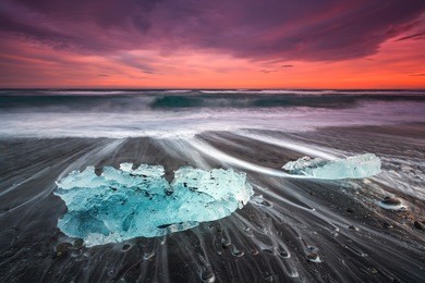 ice on the black volcanic beach near jokulsarlon glacier lagoon, winter iceland