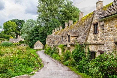 houses of arlington row in the village of bibury, england, united kingdom