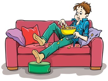 boy on the couch watching a movie with popcorn