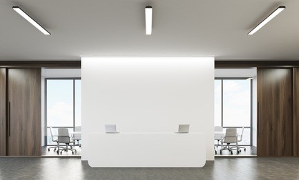 reception table with two laptops and conference room with glass walls in the background. concept of company office. 3d rendering. mock up.