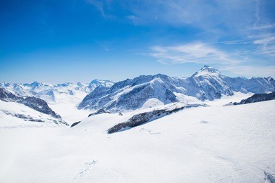 aerial view of the alps mountains in switzerland. view from helicopter in swiss alps. mountain tops in snow. breathtaking view of jungfraujoch and the unesco world heritage - the aletsch glacier