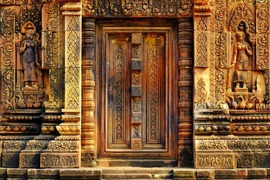 intricately carved door (portal) in the banteay srei temple in cambodia.