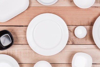 top view group of empty dish on wood background textured