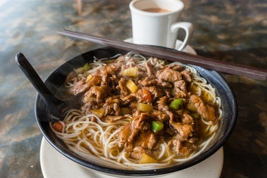 satay beef soup noodles is featured in many hong kong cafes. typically served with milk tea, the local dish is a favorite breakfast or lunch item for hong kongers.