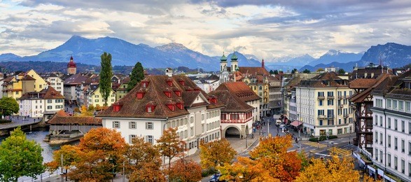 panoramic view of the old town of lucerne with alps mountains in background, switzerland