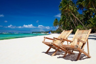 two beach chairs on perfect tropical white sand beach in boracay, philippines