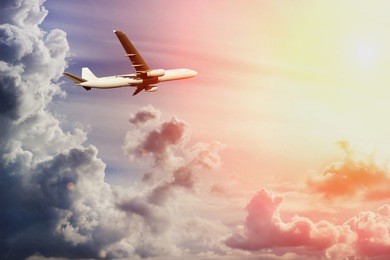 airplane in amazing sky with sun