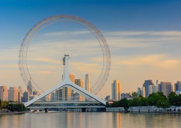 cityscape of tianjin ferris wheel,tianjin eyes in evening time with long expusure effect. most popular modern toursit attraction  in tianjin city china.