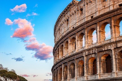 colosseum at sunset in rome, italy
