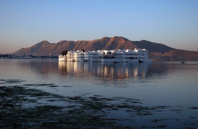 sun rising over lake palace