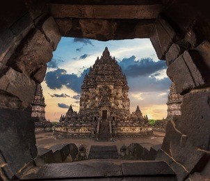dramatic and dynamic sunset at prambanan temple of yogyakarta