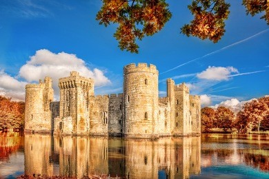 historic bodiam castle with autumn leaves in east sussex, england