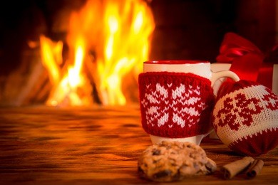 christmas decoration near fireplace. winter holiday xmas and new year concept