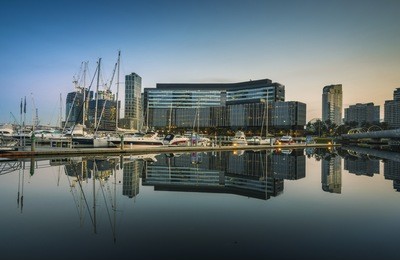 early morning mirror reflections melbourne docklands marina clear calm sky