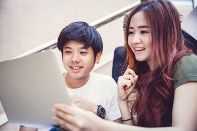 group of happy teen high school students outdoors