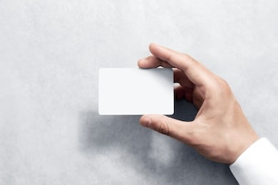 hand hold blank white card mockup with rounded corners. plain call-card mock up template holding arm. plastic credit namecard display front. check offset card design. business branding.