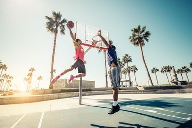 friends playing basketball - afro-american players having a friendly match outdoors