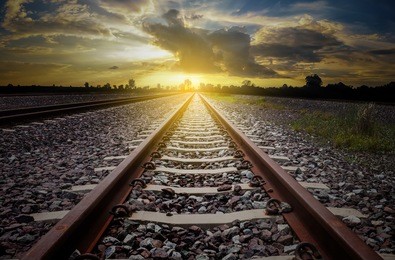 railroad for transportation with sunlight and silhouette, dark tone transport railway, concept the way to go  to the target