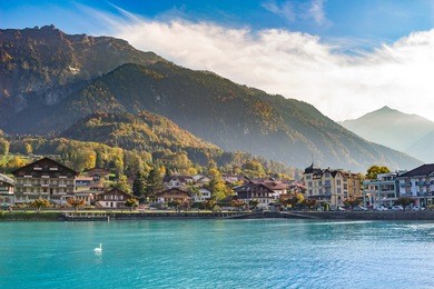 rural houses along breinz lake with leaves of autumn at interlaken, switzerland