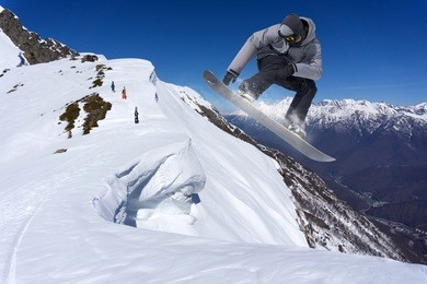 snowboarder jumping on mountains. extreme snowboard freeride sport.