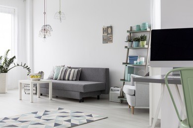 shot of a modern woman's bedroom with bright wooden floor
